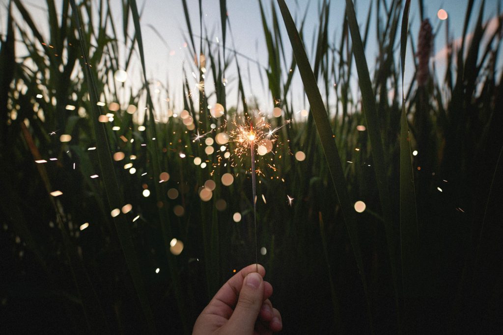 sparkler in front of grass